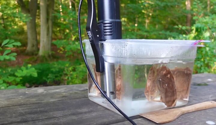 we dumped out grill for this game changing rv kitchen gadget, Placing the bag in the water