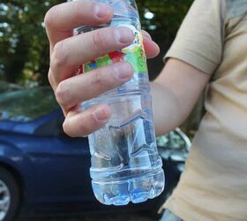 things to stop buying to save money, plastic water bottle in a persons hand