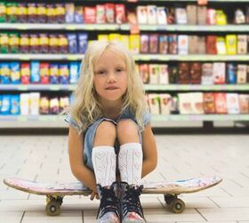 things to stop buying to save money, child sitting on floor of grocery isle near packaged foods