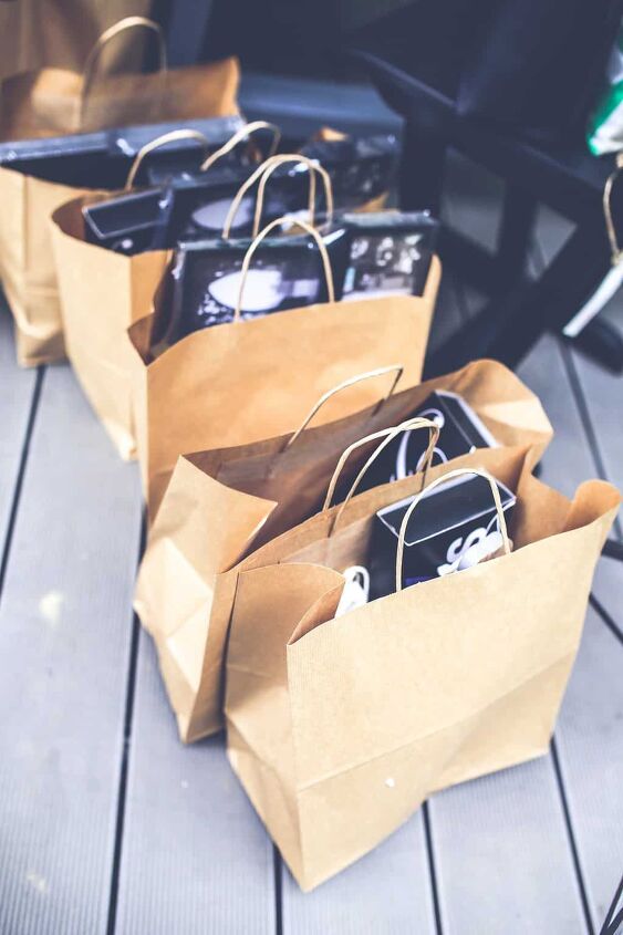 things to stop buying to save money, brown bags filled with purchases