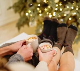 clutter free gifts for every family member this christmas, Drinking hot chocolate by the Christmas tree