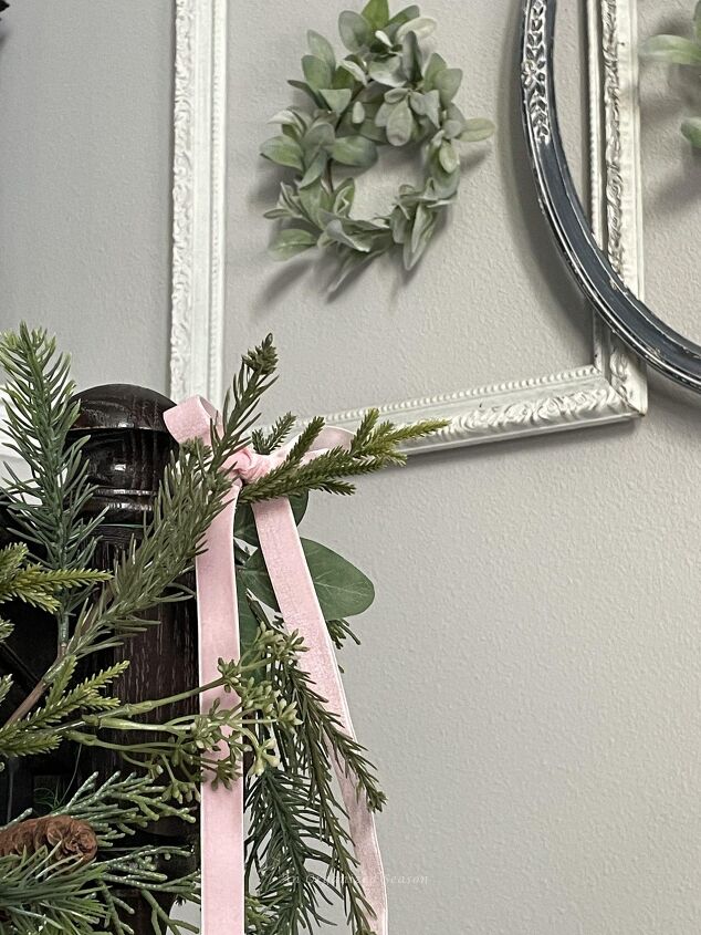 seven ways to decorate for christmas on a budget, A bow made out of pink velvet ribbon and hanging on a garland is a good way to decorate for Christmas on a budget