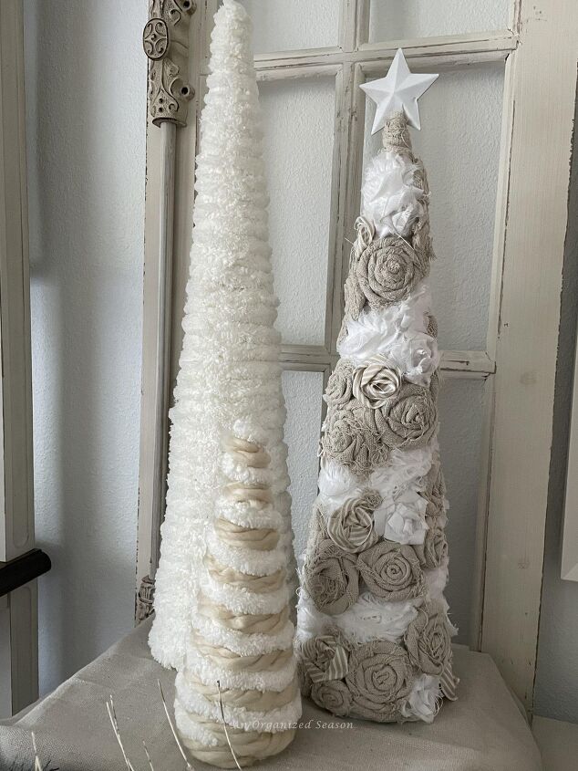 seven ways to decorate for christmas on a budget, Cone Christmas trees made with yarn drop cloth pieces and ribbon