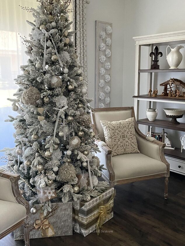 seven ways to decorate for christmas on a budget, A Christmas tree decorated in neutral colors of white cream and champagne