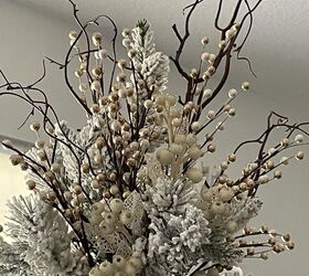 seven ways to decorate for christmas on a budget, A Christmas tree topper made from tree branches white berries and champagne and white floral picks