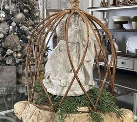 seven ways to decorate for christmas on a budget, A cloche with a statue of the Holy Family inside