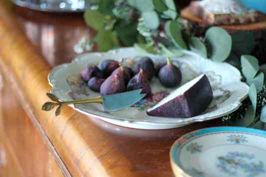 how to use a garland for everyday holidays, Plate of figs and cheese on antique buffet