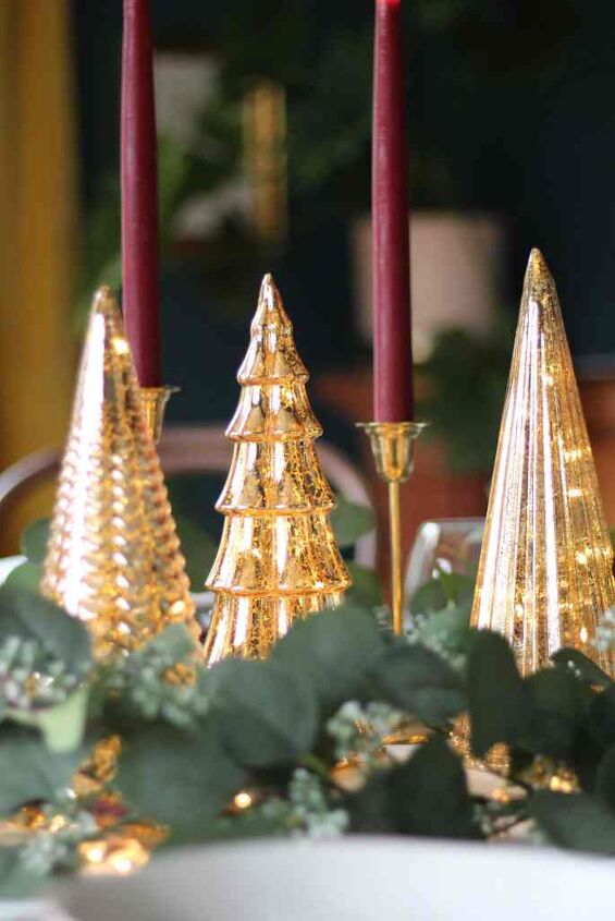 how to use a garland for everyday holidays, Lit up mercury glass Christmas tree statues by brass candle holders How to use garland everyday and holidays