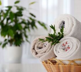 10 interior design hacks to make your home look expensive, Towels rolled up in the bathroom