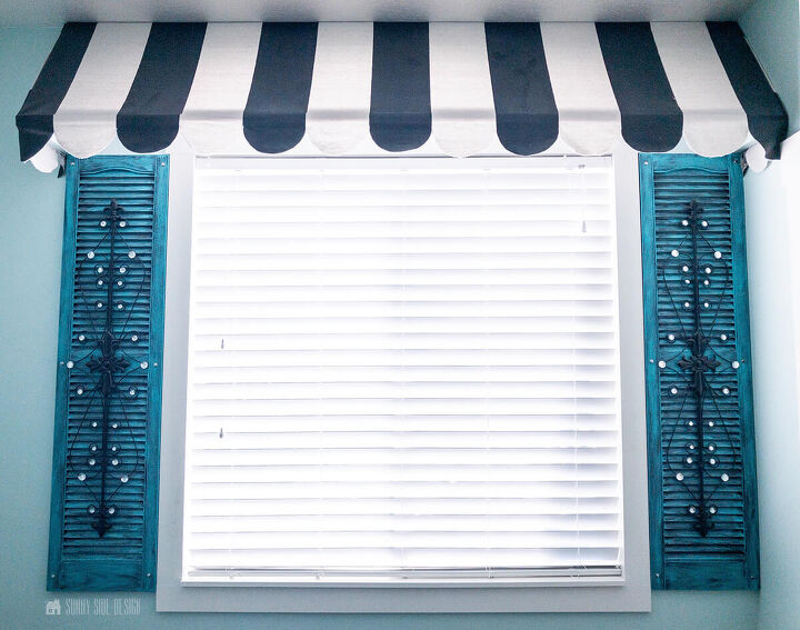 10 sensational home improvement ideas on a budget, WINDOW TREATMENT IDEAS black and white striped awning over window flanked by teal and iron shutters