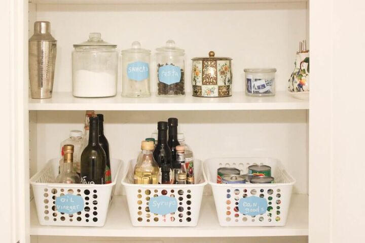 30 affordable pantry organization storage ideas you need to see, White dollar store baskets are used to organize the pantry filled with canned goods oils and vinegar