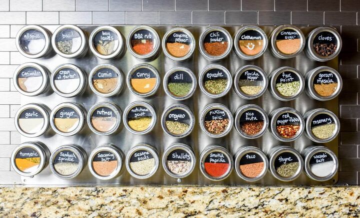 30 affordable pantry organization storage ideas you need to see, Round metal and glass spice jars are label and store with magnets on a metal sheet mounted on the backsplash