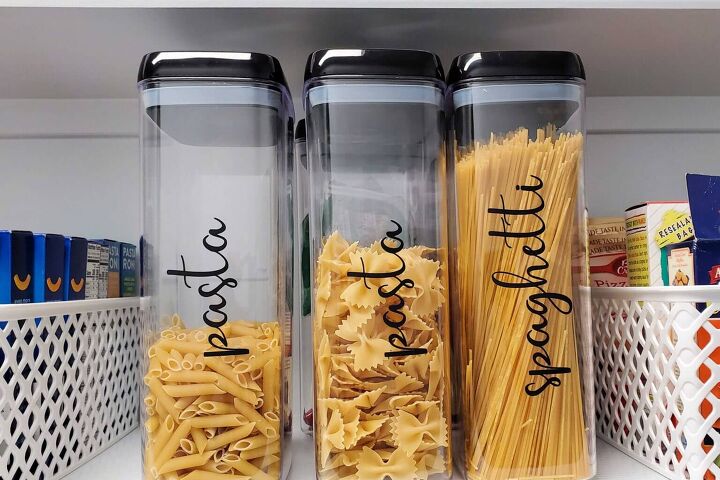 30 affordable pantry organization storage ideas you need to see, Clear plastic containers store pasta labeled with black vinyl lettering
