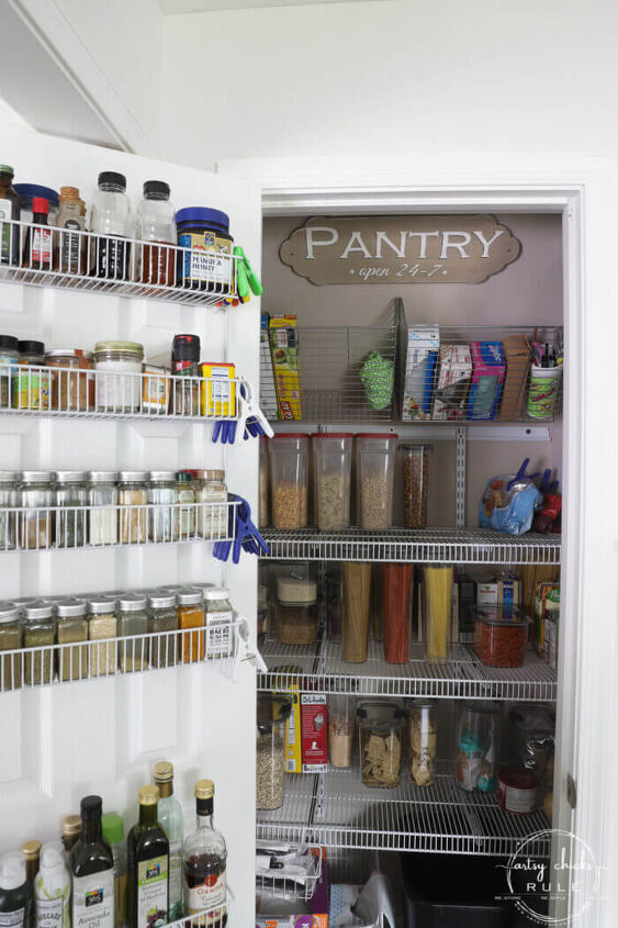30 affordable pantry organization storage ideas you need to see, Pantry door is used to organize spices oils and vinegar with a wire shelving system