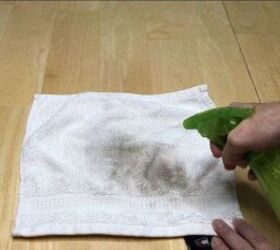 amazing diy laundry hacks that will save you money, Spraying the mixture on the stains