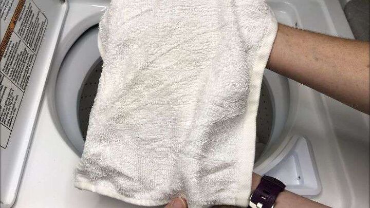 amazing diy laundry hacks that will save you money, Placing towel in washing machine