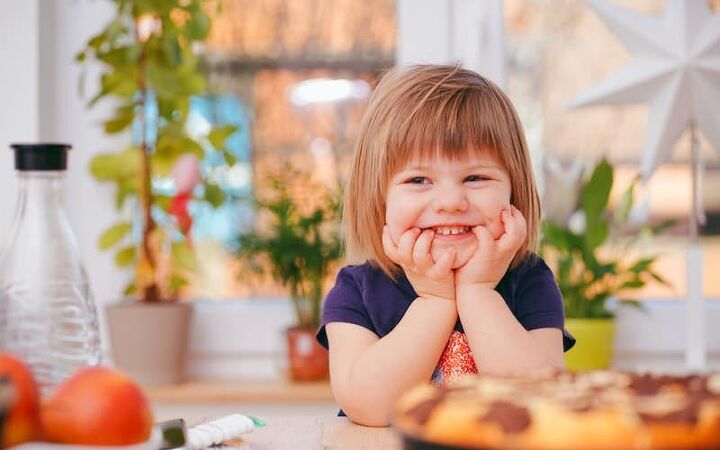 tips to help parents reduce food waste due to picky eaters, happy girl at the lunch table