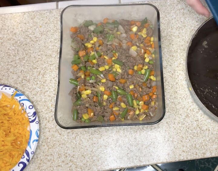 3 quick easy budget meals for a family of 4, Pouring the beef mixture into a casserole dish