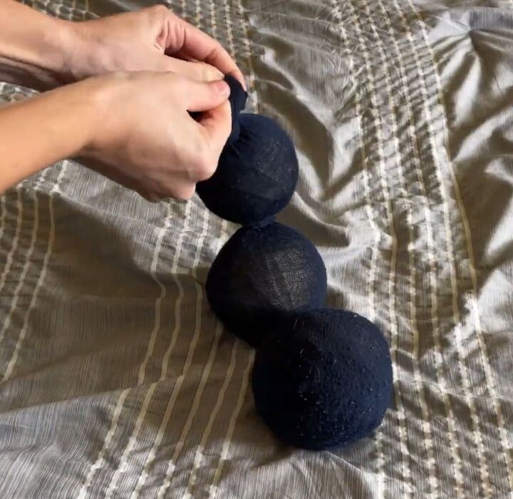 how to easily make homemade dryer balls a natural alternative, Dropping the balls into a stocking