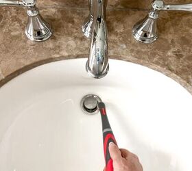 over 30 cleaning tools that make life easier, Using Rubbermaid power scrubber on bathroom sink