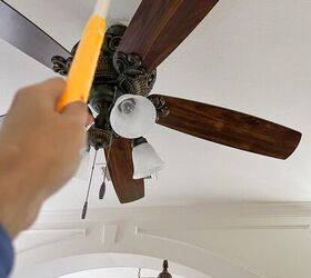 over 30 cleaning tools that make life easier, Cleaning ceiling fan with Swiffer duster
