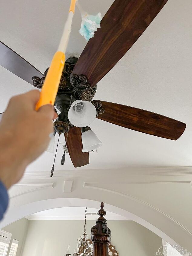 over 30 cleaning tools that make life easier, Cleaning ceiling fan with Swiffer duster