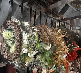 how to pack christmas decorations to make it easier next year, Wreaths hanging on a closet rod in attic