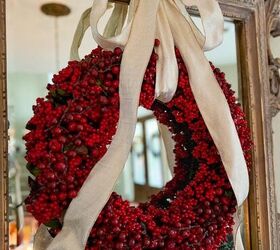 how to pack christmas decorations to make it easier next year, red berry wreath with bow on mirror