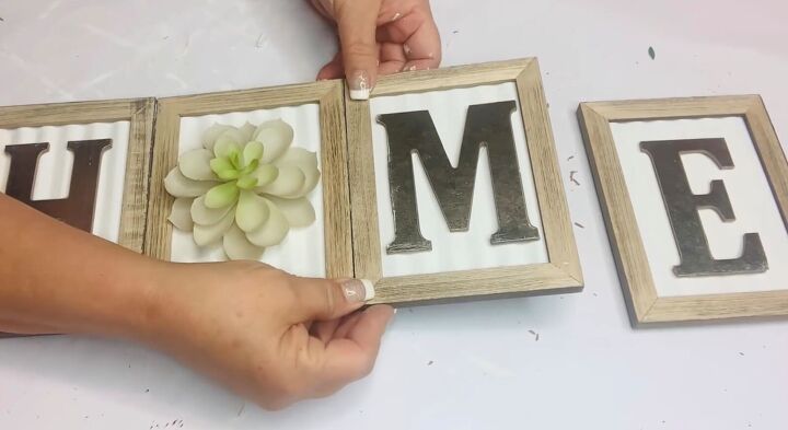 5 easy dollar tree diys you can make using faux succulents, Attaching the letters to frames