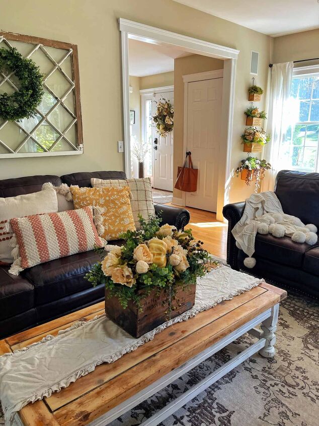 7 easy ways to make faux flowers look real, rustic farmhouse living room fall home tour 2021 with dark leather sofas and cozy fall pillows