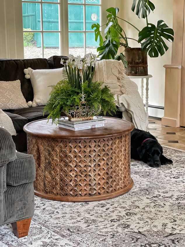 7 easy ways to make faux flowers look real, After the Family room makeover with round coffee table with flear market find filled with faux flowers and greens with black lab on area rug and houseplants
