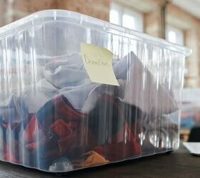 the benefits of decluttering your possessions, a plastic tub full of clothets