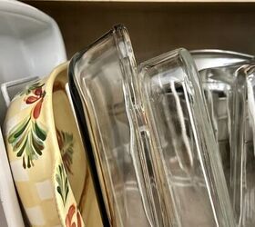 25 simple ideas for how to declutter your kitchen, Store your casserole dishes and platters vertically in lower cabinets