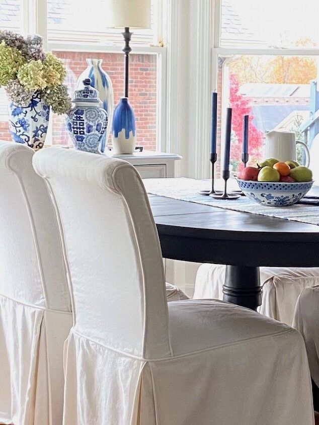 how to accessorize a kitchen 20 easy decor tips, Slipcovered Dining Chairs in Kitchen