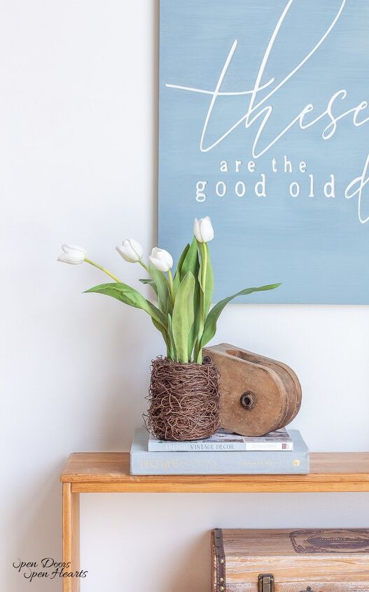 simple beautiful spring decor ideas spring home tour, a nest of spring tulips on a raw wood bookcase