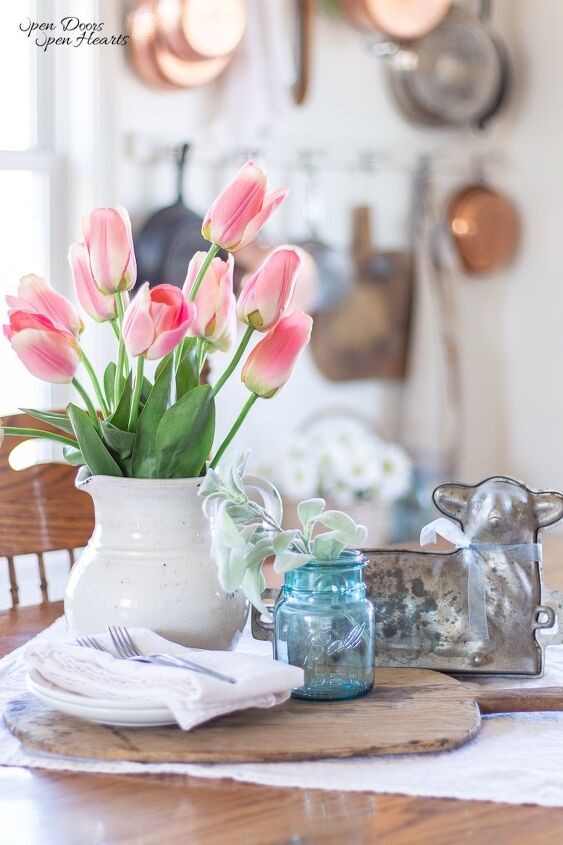 simple beautiful spring decor ideas spring home tour, Table centerpiece with tulips a lamb mold and a vintage bread board for Spring decor