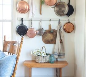 simple beautiful spring decor ideas spring home tour, copperware displayed on a wall rack