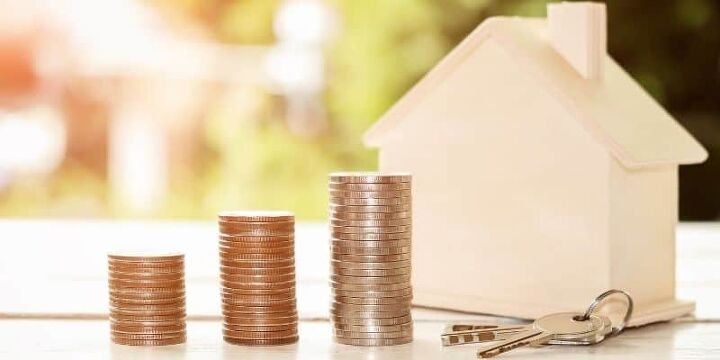 how to save for a house deposit in 2023, piles of coins wooden house and keys