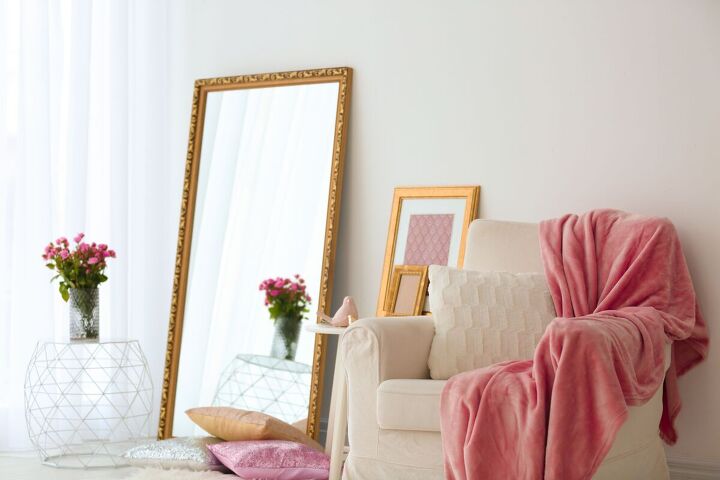 how to make a small space look bigger 9 tips tricks, Using a large mirror to trick the eye