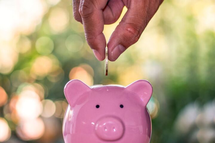 how to avoid lifestyle creep 10 tips for keeping finances in check, Saving money in a piggy bank