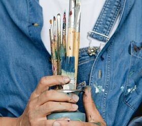 how to declutter craft supplies 6 simple tips for your creative space, How to declutter craft supplies woman holding paint brushes