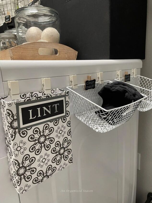 tips to create a beautiful organized laundry roomif typeof ez ad uni, Attach a lint bin and small wire baskets for clean and dirty masks on the side of the dryer tip seven to create an organized laundry room