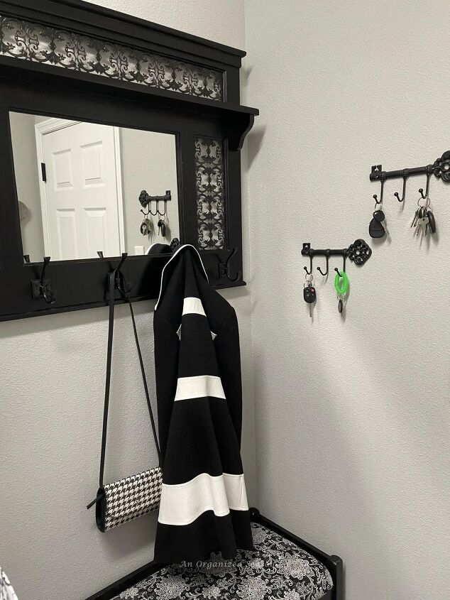 tips to create a beautiful organized laundry roomif typeof ez ad uni, Coat purse and keys hanging by the door in the laundry room