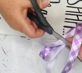 3 diy spring decor crafts you can make with dollar tree items, Cutting a purple ribbon