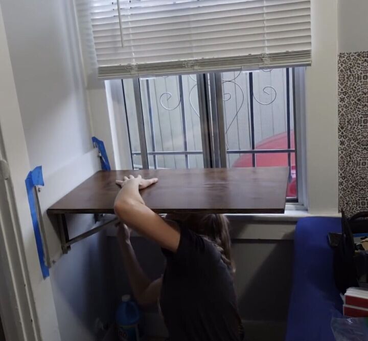 how to do a cute studio apartment makeover in a 100sqft space, Installing a flip desk