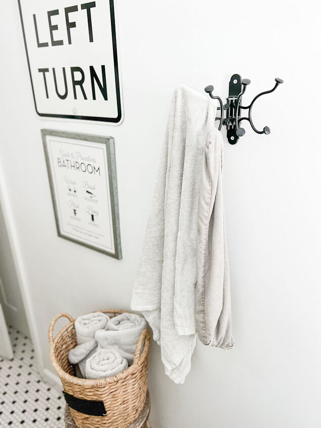 simple decor series how to decorate a small bathroom on a budget, Towel hook from Pottery Barn easily holds 4 8 towels at a time The black metal matches its surrounding perfectly