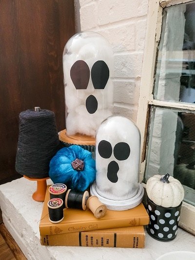 how to fill a glass cloche for every season, Classic white orange and black Halloween mantel with pops of blue