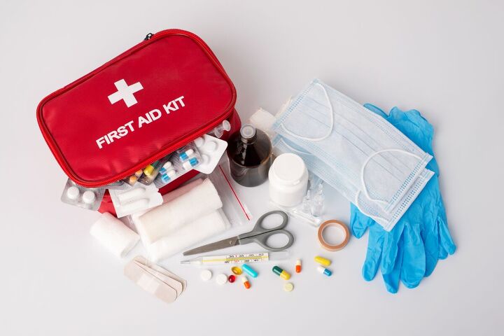 survival essentials the best food to stockpile for any crisis, First Aid kit with supplies