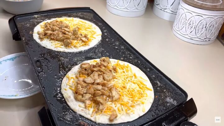 the best copycat fast food recipes you need to try, Two homemade Taco Bell chicken quesadillas on a griddle