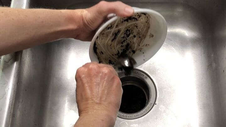 how to use ground coffee with these 10 amazing and easy hacks, Pour your coffee grounds into your garbage disposal Run the disposal and it will clean and deodorize it